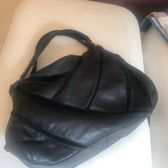 Cole Haan black “saddle” bag by Maria Sharapova